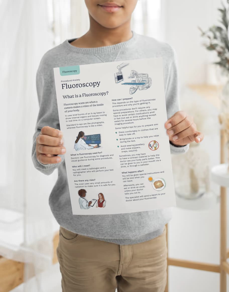 Child holding a Fluoroscopy leaflet