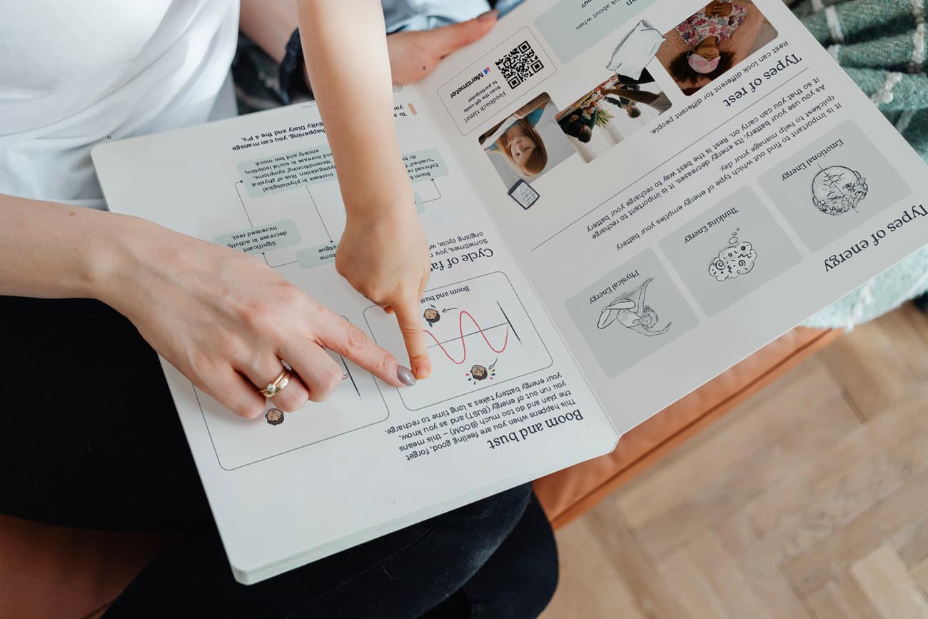 Mother and child reading a Recovery workbook